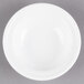 A Libbey alpine white porcelain fruit bowl on a white surface.