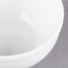 A close up of a Libbey Alpine White Porcelain Bouillon bowl with a white rim.