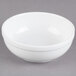 A Libbey Alpine White Porcelain Nappie Bowl on a white surface.