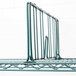 A close up of a Metroseal green metal shelf with a Metro wire shelf divider.