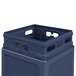 A close-up of a dark blue plastic Commercial Zone PolyTec waste container with an open top.