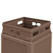 A close-up of a brown Commercial Zone PolyTec waste container with a dome lid.