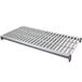 A grey metal vented shelf with a white grate with holes.