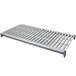 A white metal shelf with a white metal grate and 3 white metal grates with holes.