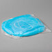 A blue round Royal Paper disposable bouffant cap in a plastic bag.
