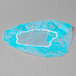 A blue Royal Paper disposable bouffant cap with white trim in a clear plastic bag.