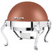 A Queen Anne round copper coated stainless steel chafing dish with chrome legs.