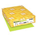 A yellow box of Astrobrights Vulcan Green color paper with white and yellow designs.