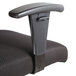A close-up of a black OIF office chair arm.