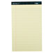 A yellow lined paper pad with blue lines.