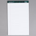 A white lined notepad with green lines.