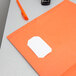 An orange Oxford letter size pocket folder with white paper inside.