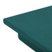A granite green Cambro well cover on a table.