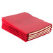 A stack of red Pendaflex personnel fastener folders.