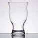 A close-up of a Libbey clear beer glass.