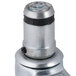 A close up of a Vulcan 4" swivel stem caster with a black cap on a metal object.