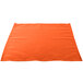 An orange cloth napkin on a white background.
