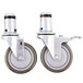A pair of Vulcan metal swivel stem casters with rubber wheels.