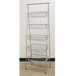 A silver metal rectangular 5-tier pane stand with metal baskets on it.