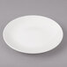A white Bon Chef porcelain bread and butter plate with a rim.