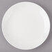 A white Bon Chef porcelain bread and butter plate with a rim.