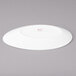 A white Bon Chef slanted oval porcelain plate.