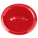 A red Bon Chef porcelain oval cocotte lid with a handle.