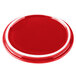 A red porcelain oval lid with a white rim.