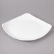 A white square Bon Chef porcelain plate on a gray surface.