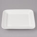 A white rectangular Bon Chef porcelain plate with small circle details.