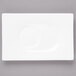 A white rectangular plate with a circle in the middle.