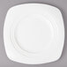 A white Bon Chef soft square porcelain dinner plate on a gray surface.
