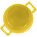 A yellow porcelain Bon Chef cocotte with handles.