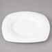 A white Bon Chef porcelain square salad plate with a circular design.