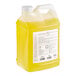 A 2.5 gallon container of yellow liquid.