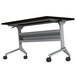 A Safco silver steel folding seminar table base with wheels.