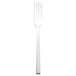 A silver Walco stainless steel salad fork with a white handle.