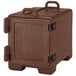 A brown plastic Cambro C-Series food pan carrier with black handles.