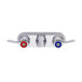 A silver Fisher faucet base with swivel outlets and lever handles with red and blue accents.
