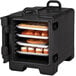 A black Cambro front loading food pan carrier with trays of pastries inside.