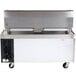 A large stainless steel Cooking Performance Group gas lava briquette charbroiler on a stainless steel chef base.