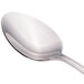 A close-up of a Walco Pacific Rim stainless steel teaspoon with a silver handle.