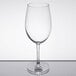 A clear Reserve by Libbey wine glass on a reflective surface.