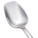 A Walco stainless steel spoon with a silver handle.