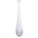 A silver Walco stainless steel serving spoon with a design on the handle.