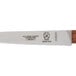 A Mercer Culinary Praxis paring knife with a rosewood handle.