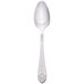 A silver Walco Meteor teaspoon with a design on the handle.