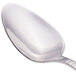 A Walco Meteor stainless steel teaspoon with a silver handle.