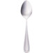 A Walco stainless steel dessert spoon with a silver handle on a white background.