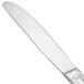A close-up of a Walco Saville stainless steel dinner knife with a silver handle and blade.